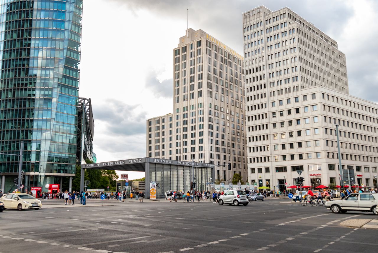 Dynamic city life at Potsdamer Platz in Berlin, showcasing modern architecture and vibrant street activity.